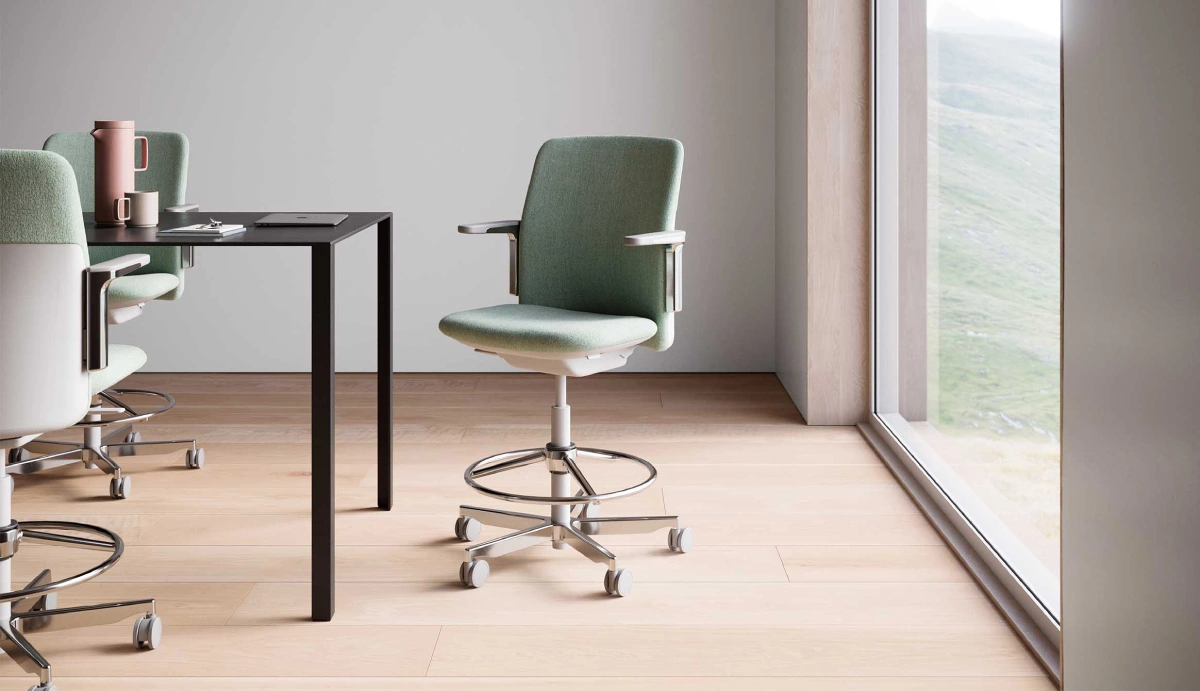 Ergonomic office interior showcasing Humanscale seating solutions designed for comfort and health in a bright, contemporary boardroom.